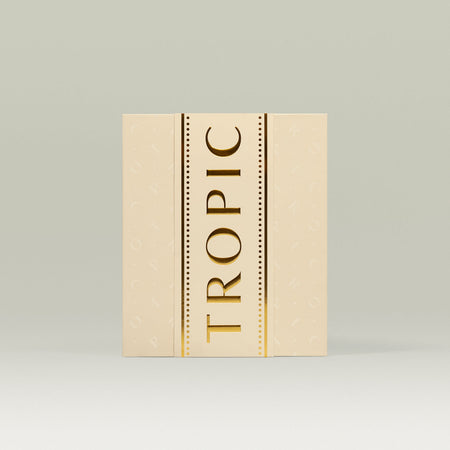 Tropic 12 Days of Tropic Advent Calendar – cream-coloured box with gold embossed 'TROPIC' lettering and subtle background pattern.